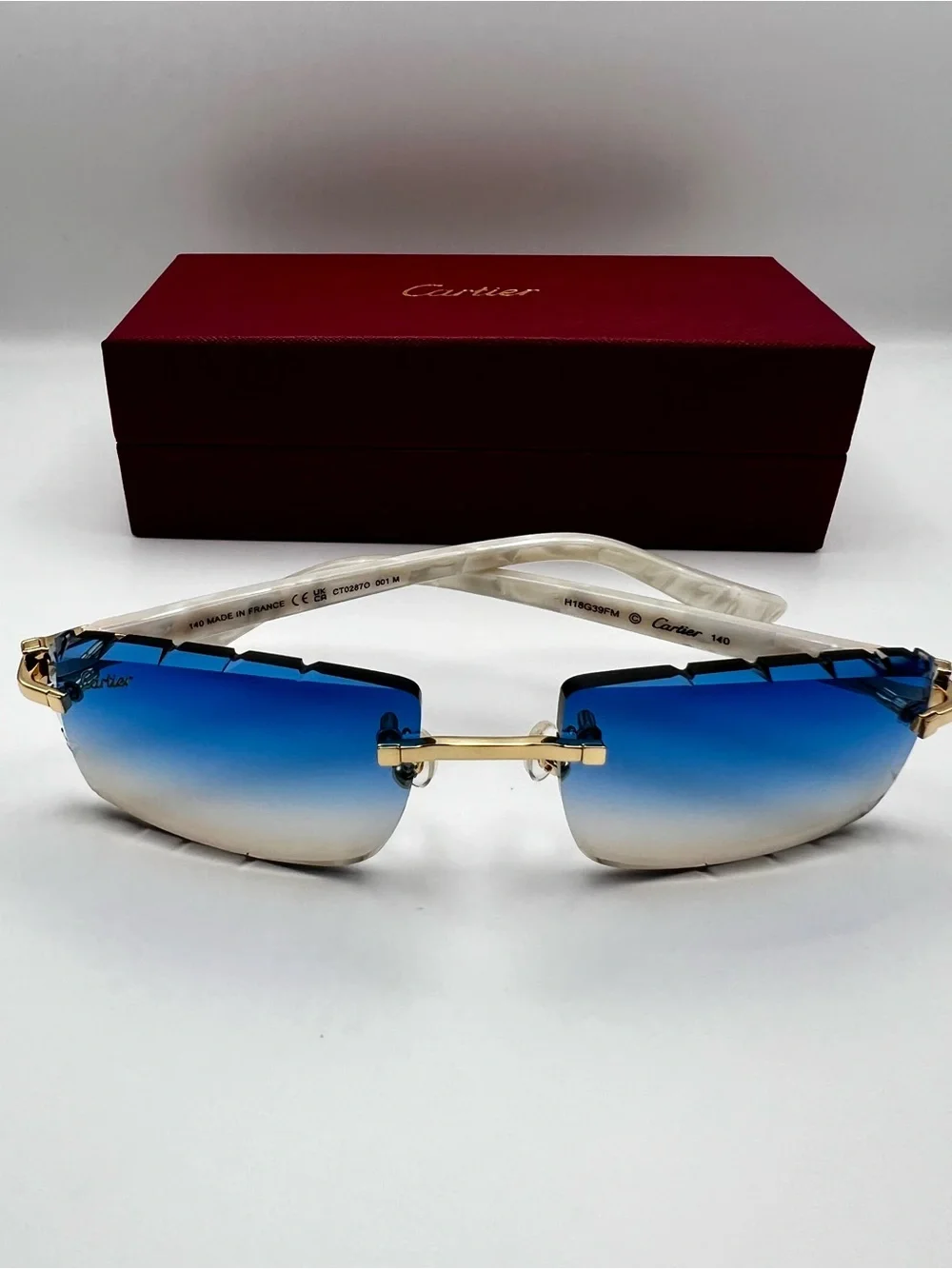 Cartier Blue Gradient Rimless Sunglasses with Gold and White Accents